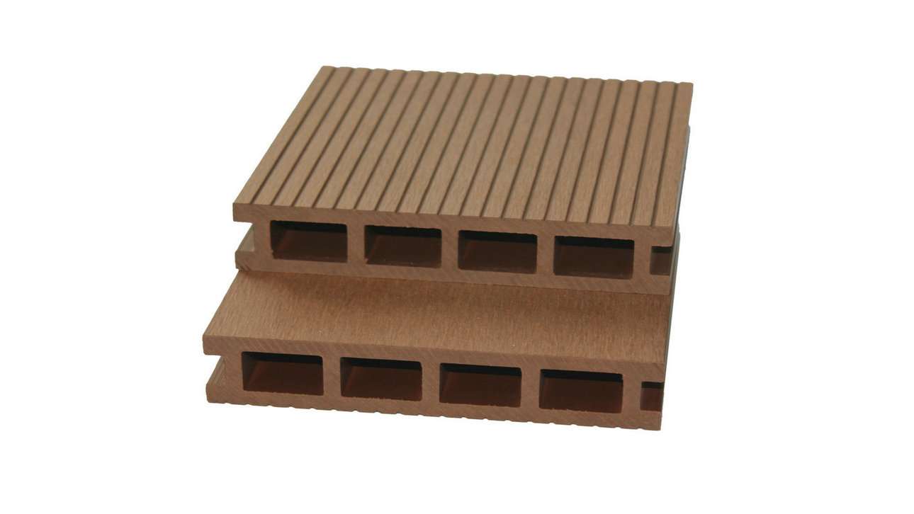 Two stacked brown grooved composite decking boards with hollow channel cross-section on a plain background