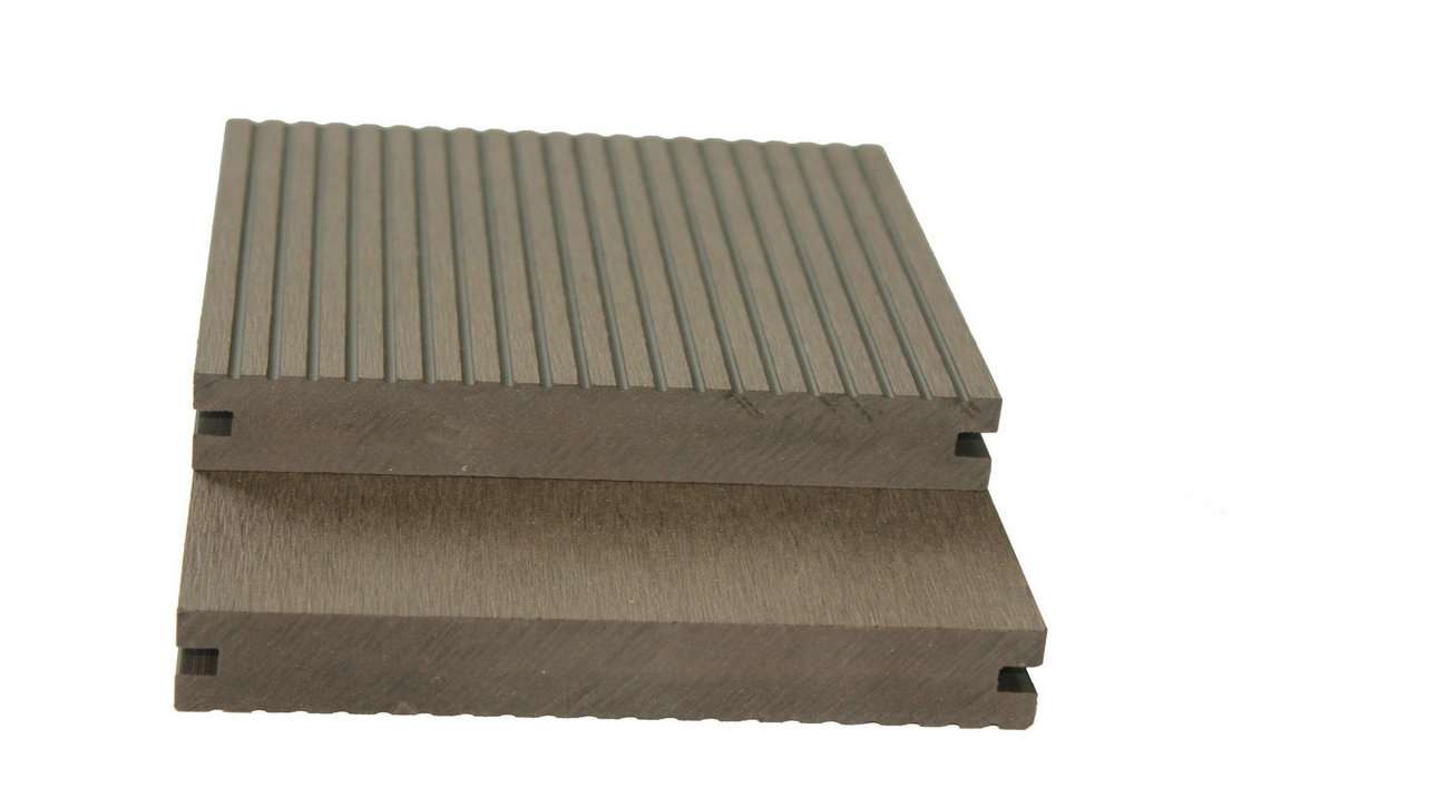Overhead flat-lay of two grey-brown deck boards, one flipped to show smooth underside, on white surface